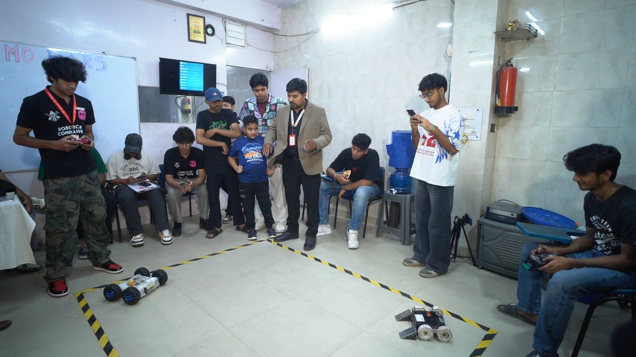 Autonomous sumo robots competing in the circular arena at Sumo Wars: First Edition 2026, organized by Robotic Sir AI India photo 1