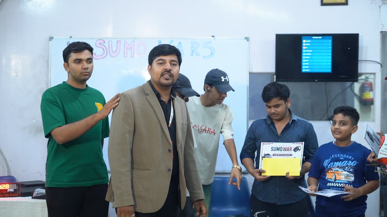 Autonomous sumo robots competing in the circular arena at Sumo Wars: First Edition 2026, organized by Robotic Sir AI India photo 4