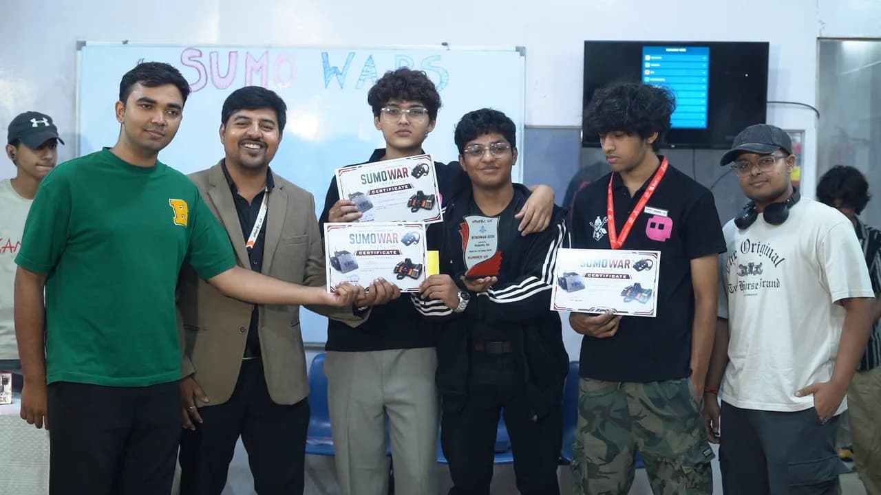 Autonomous sumo robots competing in the circular arena at Sumo Wars: First Edition 2026, organized by Robotic Sir AI India
